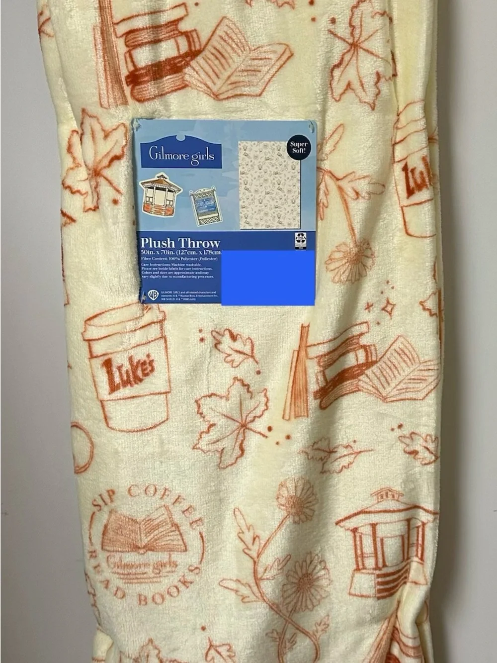 New Gilmore Girls Fall Blanket Cream and Orange Luke’s Diner Books